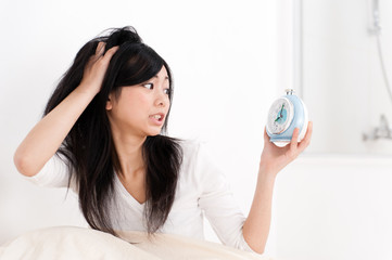 a portrait of beautiful asian woman on the bed