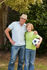 Grandfather and his grandson looking at the camera
