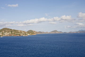 Freight and Houses on Green Tropical Coast