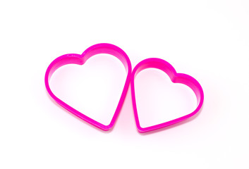 couple of pink plastic in heart shape