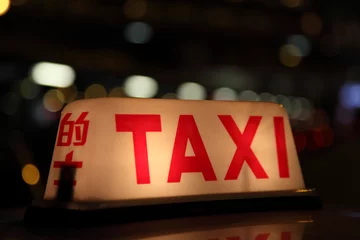 Taxi sign at night in Hong Kong