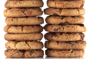 Two piles of chocolate chip cookies