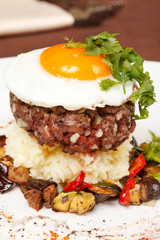 beef burger with egg and potatoes