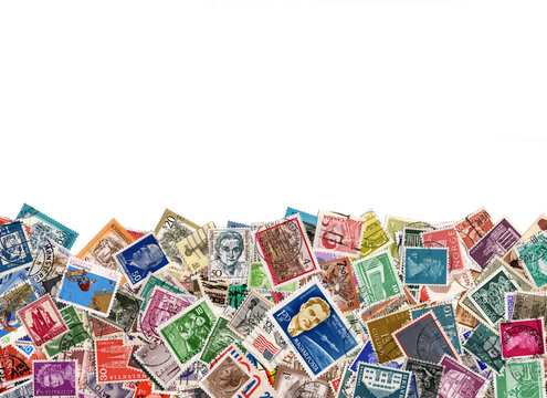 Large amount of postage stamps isolated on white