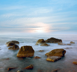 Fototapeta na wymiar seashore with stones in water
