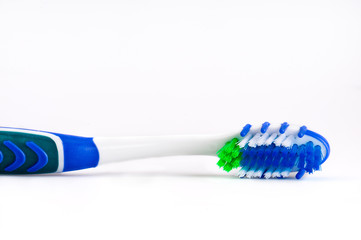 Close up of a toothbrush over white background.