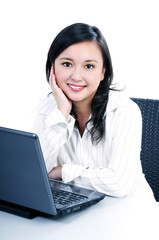 Pretty young businesswoman with laptop
