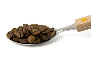 spoon with coffee beans on white background