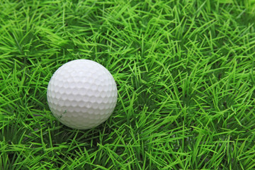 closeup of golf ball on green grass