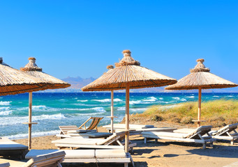 Beach with reed parasols