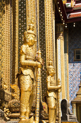 Stucco giant gold in the Temple of the Emerald Buddha, Thailand.