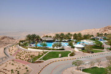 swimming pool in hotel with view of mountains