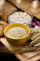 Cup of wheat and Oat grains with  bread