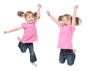 Adorable little girls jumping in air. isolated on white backgrou