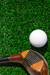 Golf Ball and driver on grass