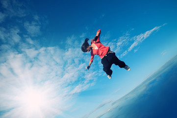 sport woman jumping and fly over sky and sun