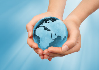 Hand holding the blue Earth