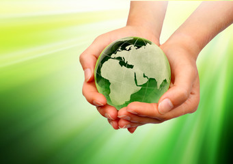 Hand holding the green Earth