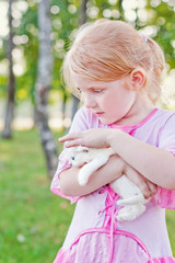 little girl with cat outdoor