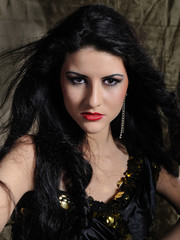 Beautiful model woman with long black healthy hair in arabic tra
