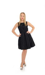 Beautiful sexy woman in elegant dress standing. studio shot. iso