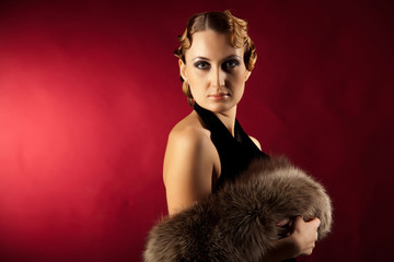 Portrait of woman holding natural fur