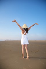 Fototapeta na wymiar white woman walking at beach