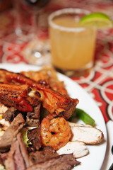 Grilled pork ribs, beef and shrimps