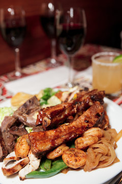 Grilled pork ribs, beef and shrimps