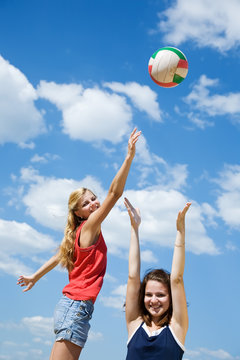 girls playing volleyball
