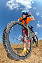 Fototapeta na wymiar portrait of a girl with bike