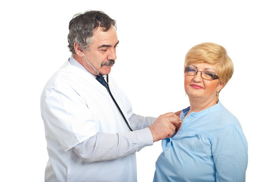 Mature doctor man examine patient woman