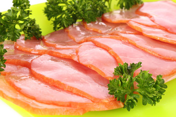 Slices of bacon on white background