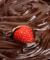 Strawberry dipped in melting dark chocolate