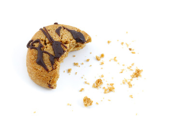 Chocolate covered cookie crumbs bite on white background