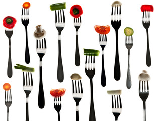 Many slice of vegetables in forks