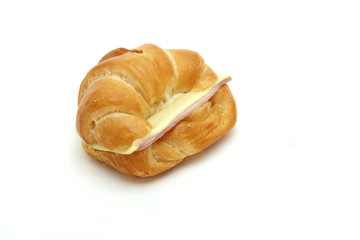 closeup of Ham Cheese croissant on white.