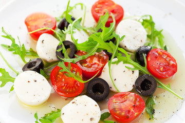 salad with mozzarella, tomatoes and black olive