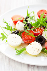 salad with mozzarella, tomatoes and black olive