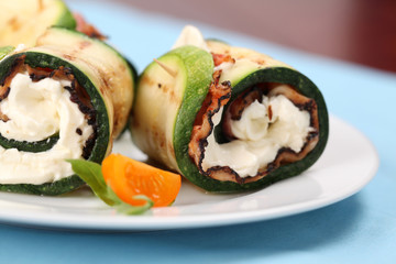 Zucchini rolls with pepper crusted bacon and cheese