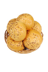 Bun, topped with sesame seeds in a basket