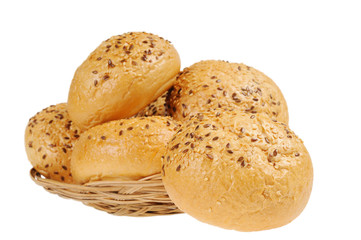 Bun, topped with sesame seeds in a basket