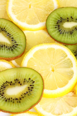 Kiwi and lemon slices on white background