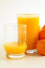 Obraz na płótnie Canvas orange juice in glasses