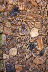 Beige and black stone wall vertical