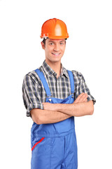 Manual worker wearing blue overall and helmet