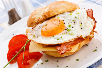 Breakfast - fried egg with bacon and cheese