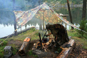 Man cooking at camp