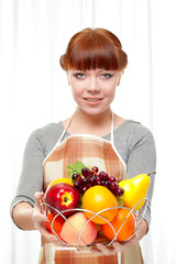 ginger housewife holding fruits