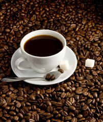 cup of coffee on beans